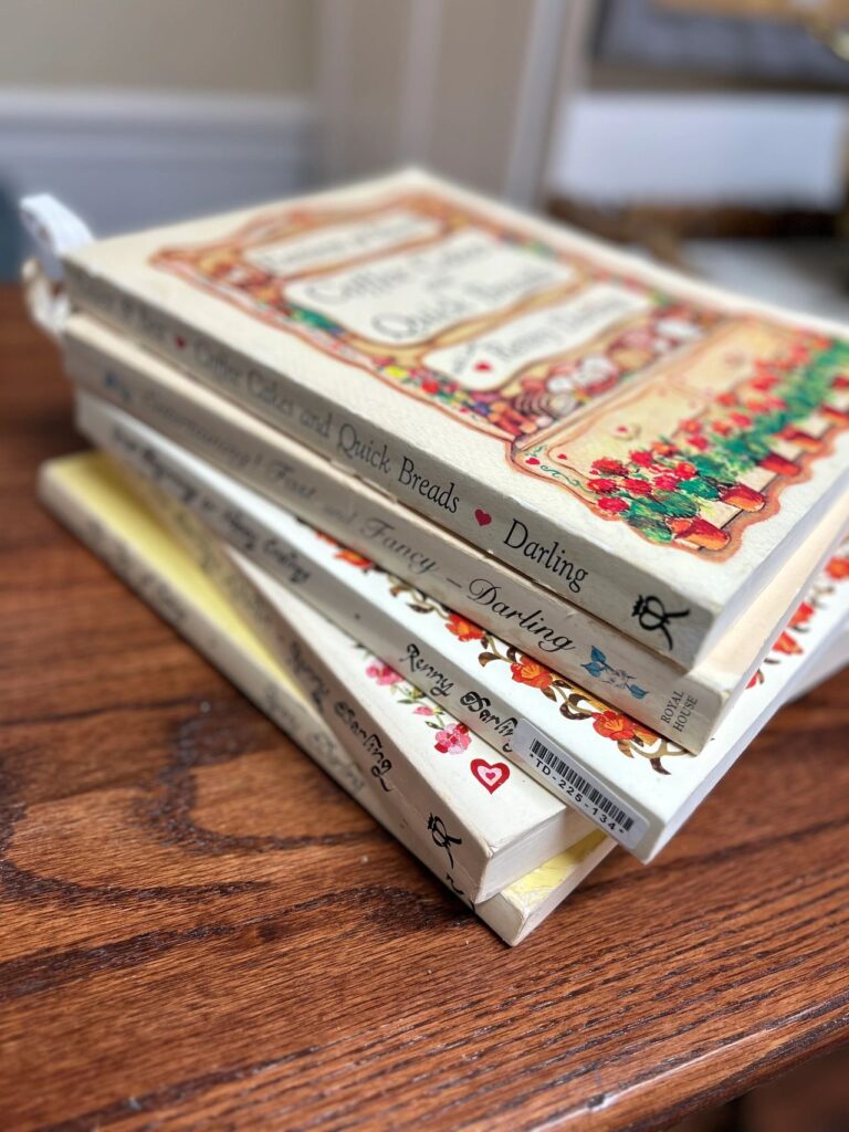 Stack of Renny Darling vintage cookbooks