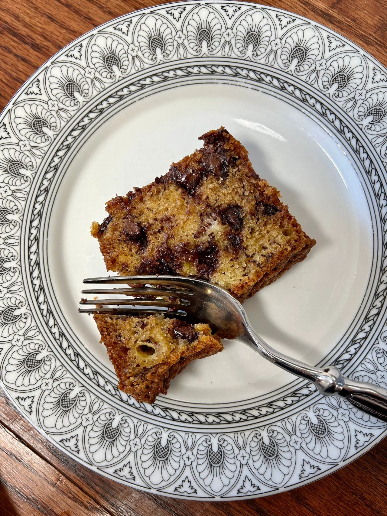 Piece of chocolate chip banana bread from Renny Darling cookbook sitting on a plate