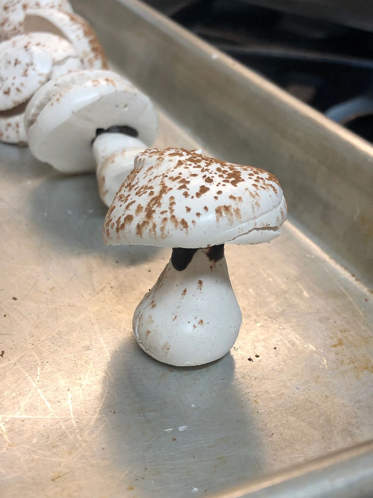 Meringue mushrooms assembled and drying.