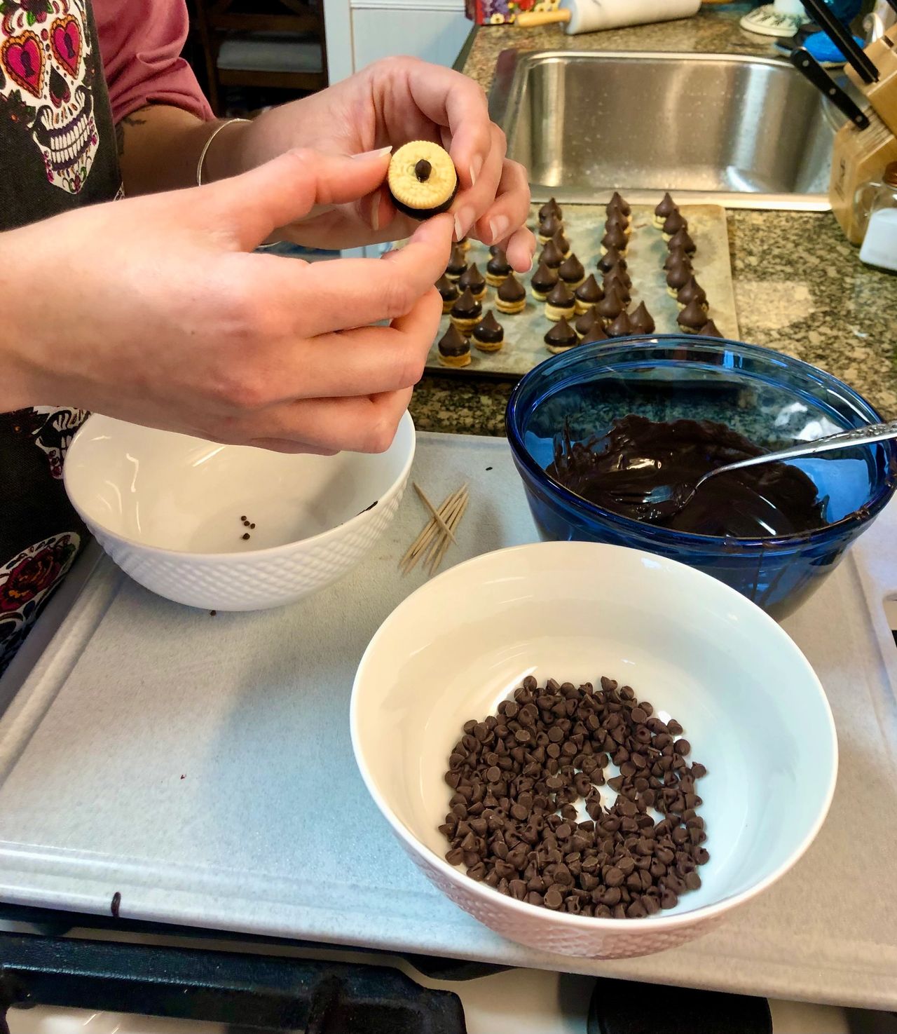 Gluing on the mini chocolate chips.