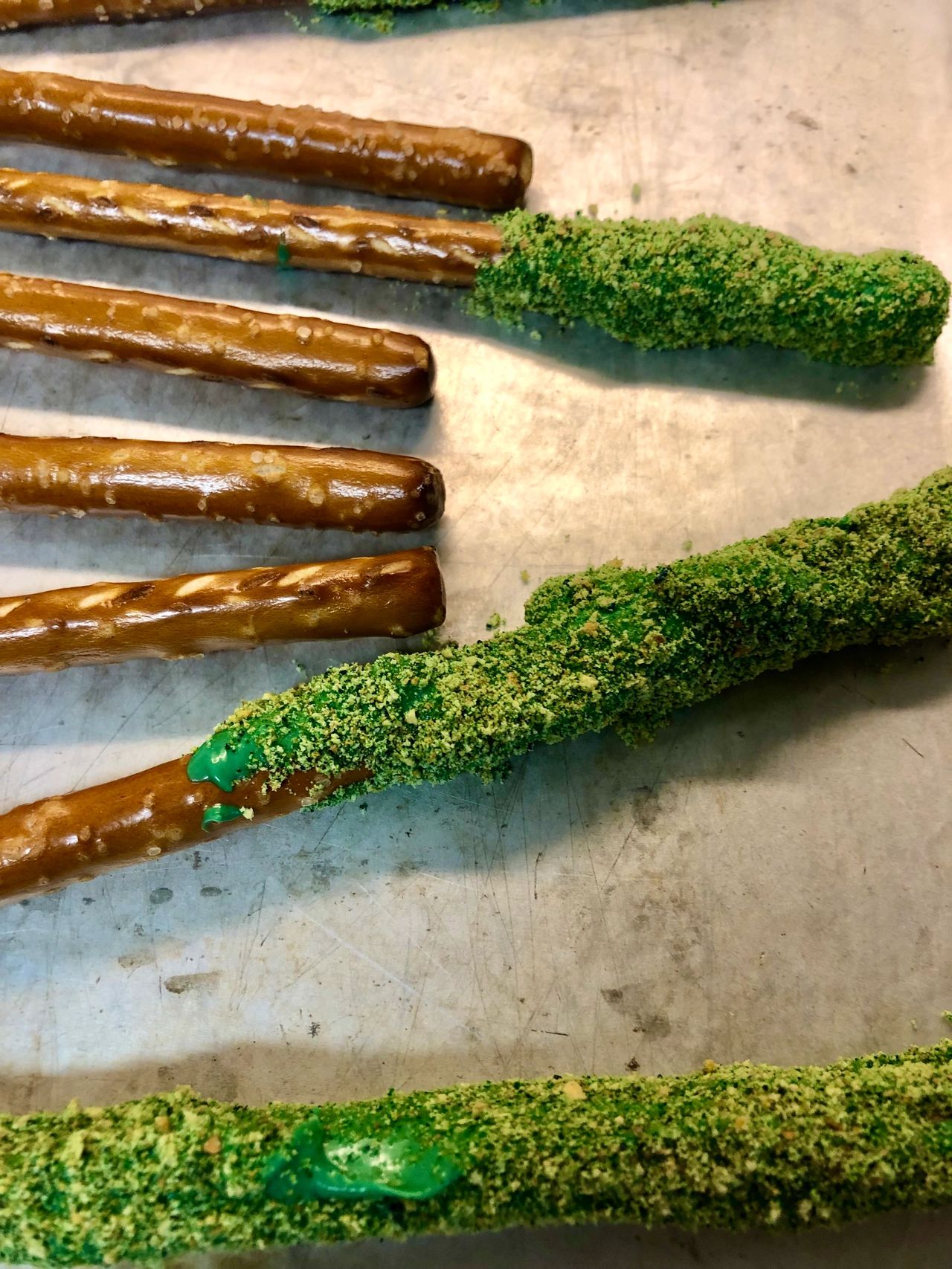Moss-covered pretzel rods in progress.