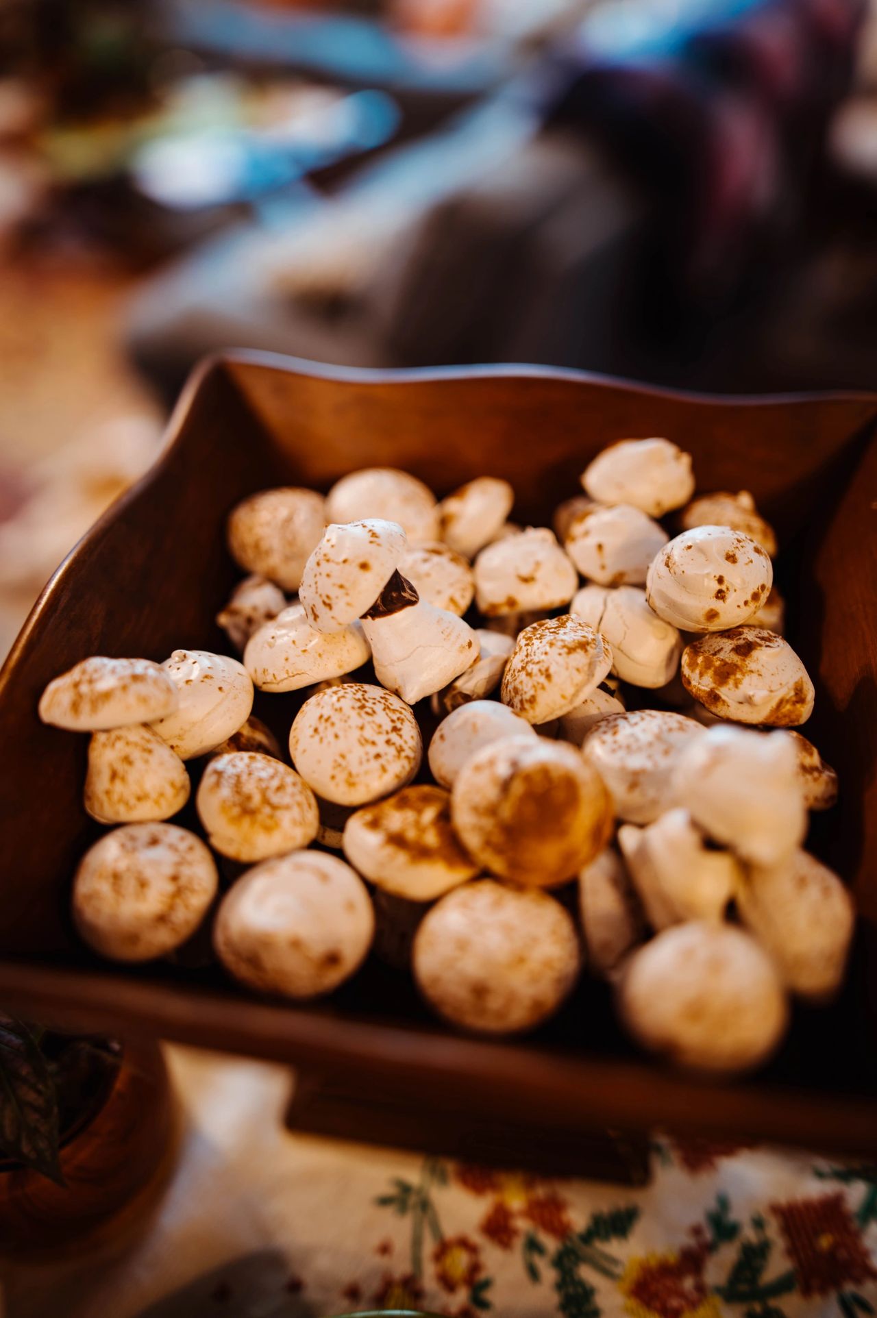 Meringue mushrooms are perfect in a vintage wooden stand.  Photo credit: Claire Keathley Photography