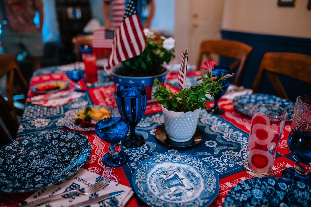 Dishes and linens from decades of collecting create a fun tablescape for Fourth of July.