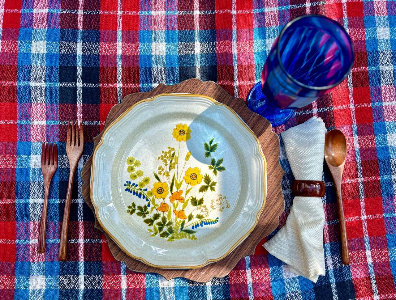 Vintage dishes on a plaid tablecloth