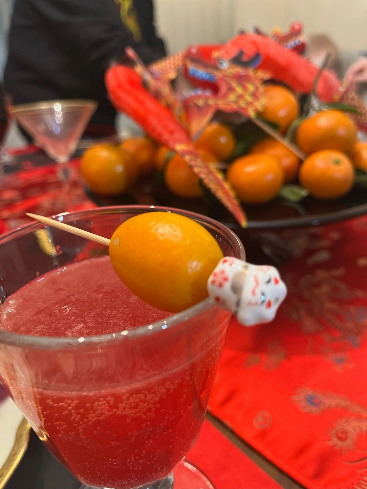 Lucky Cat beads on cocktail picks with kumquats and tangerines.