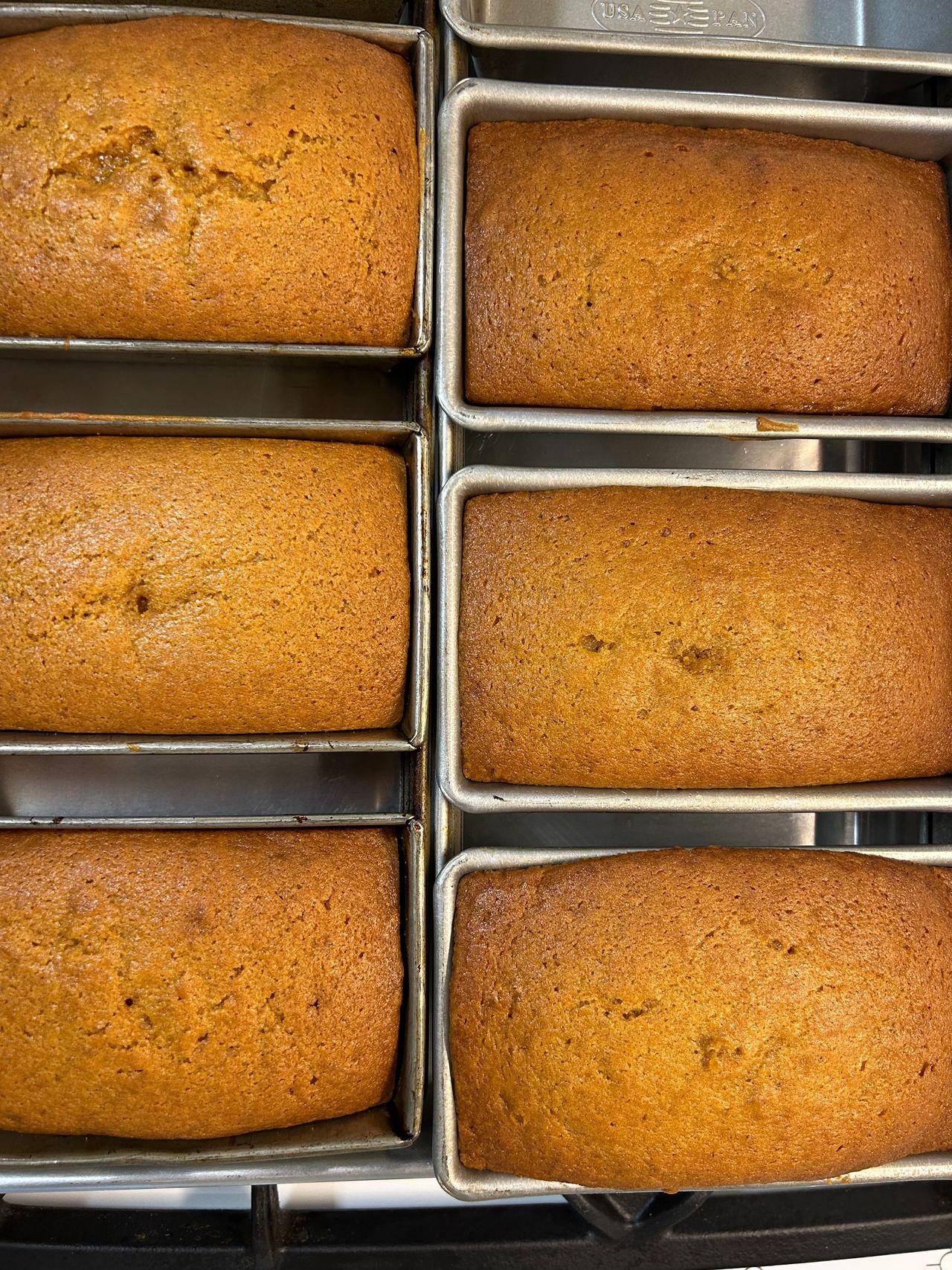 Loaves of pumpkin bread in the pan.