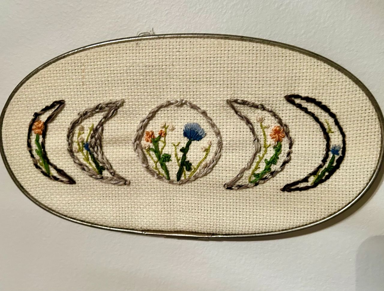 Moon and floral cross-stitch