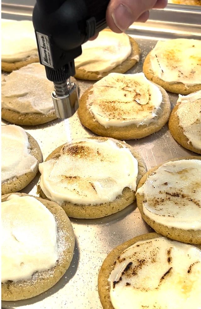 A kitchen torch brûlées the cream cheese icing.