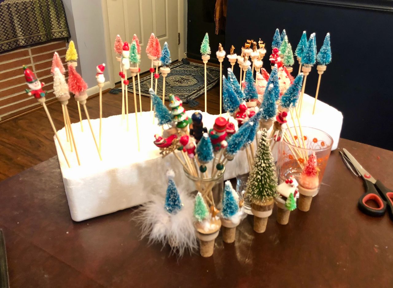 Miniature Christmas ornaments on sticks in styrofoam