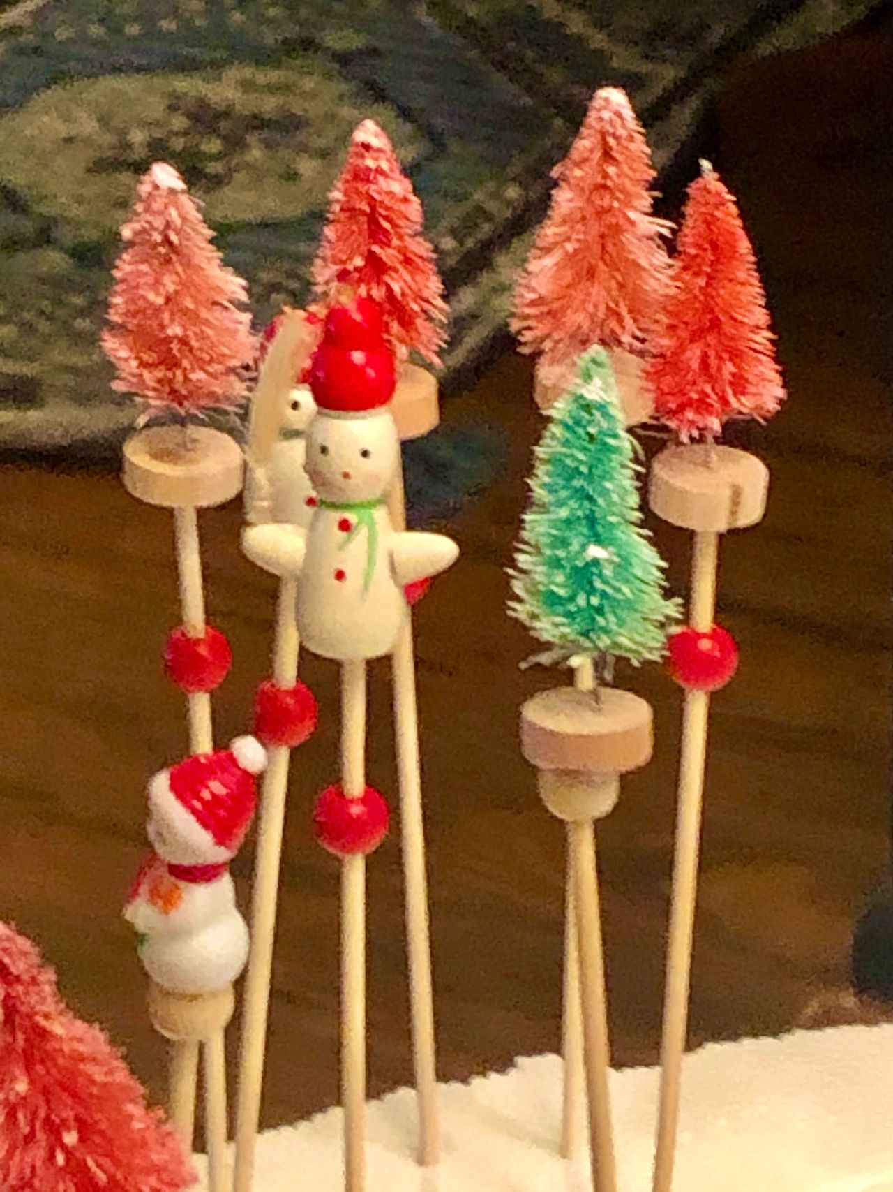 Miniature trees and snowman cocktail picks.