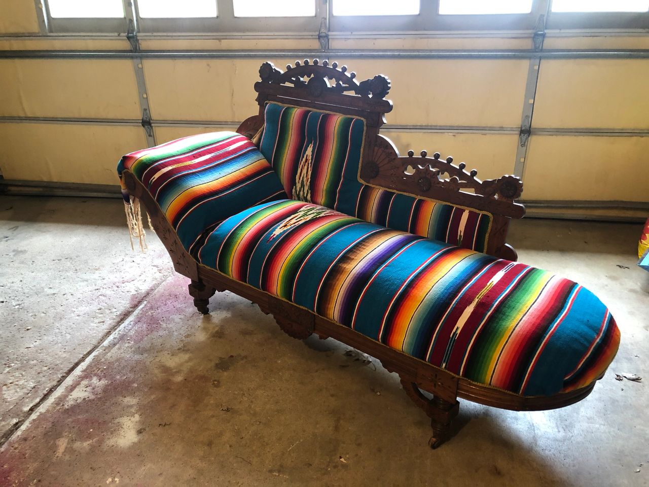 Vintage Eastlake chaise lounge in a garage