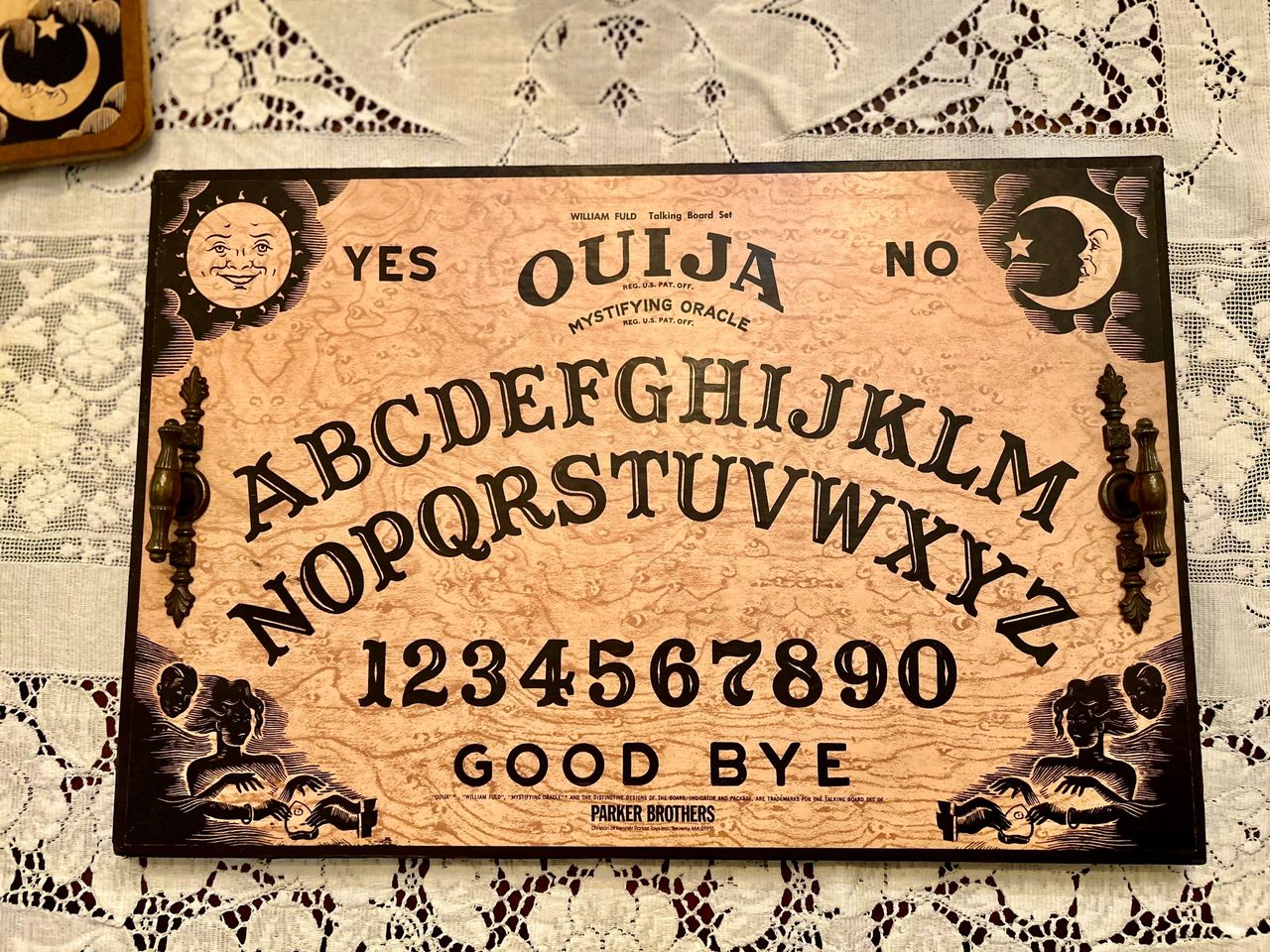 A vintage Ouija board found at a garage sale for $1 is up cycled into a Halloween tray.