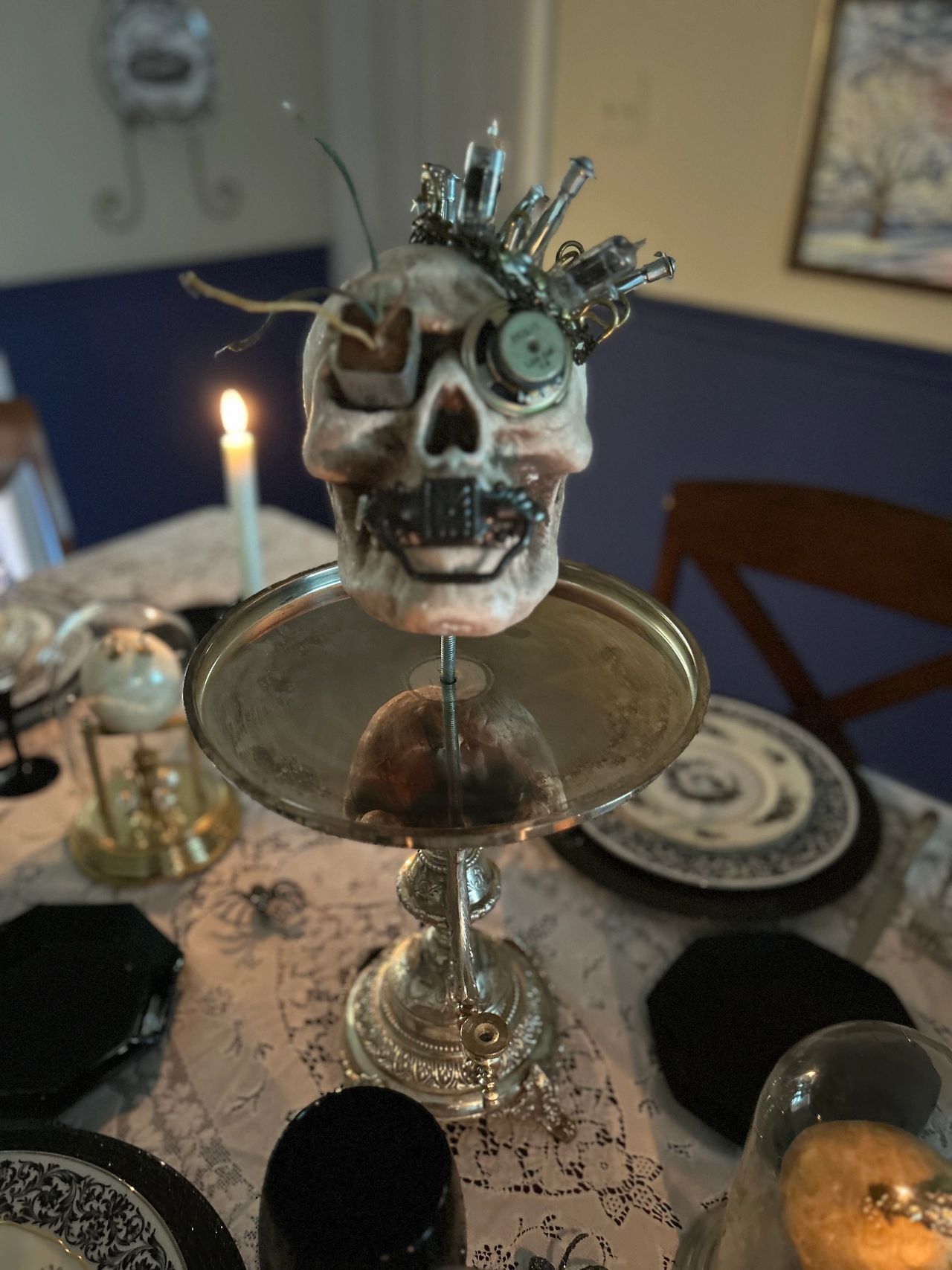 A steampunk skull on a broken silver server I found at an estate sale for $1. 