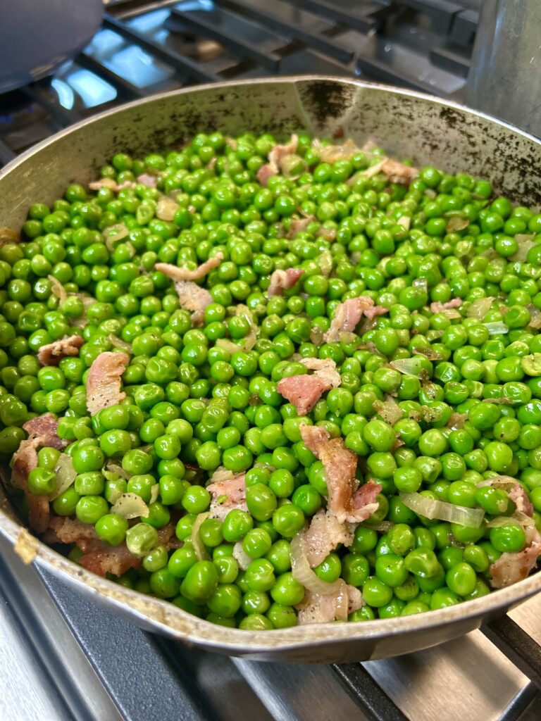 Green peas with bacon and black pepper