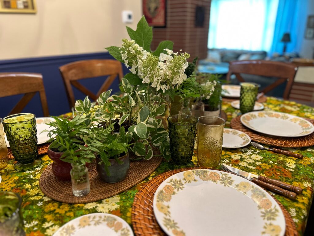 Fresh cuttings from the garden create a centerpiece for a green and yellow themed spring  table.