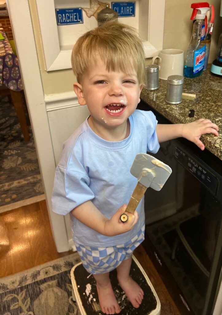 Toddler with a cooking spatula